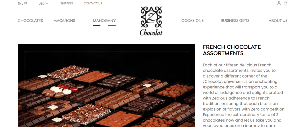 An assortment of French chocolates displayed on a black backdrop, showcasing various shapes and flavors.